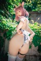 A woman in a bunny costume posing for a picture.